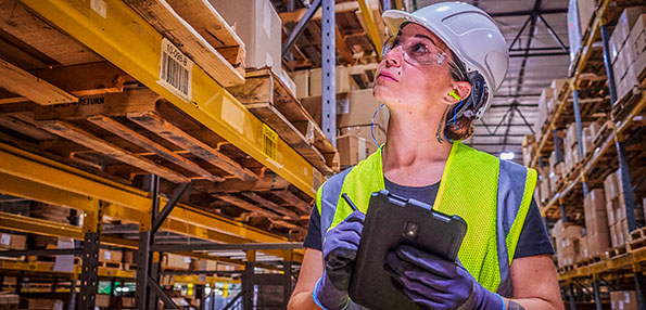  Person in warehouse taking inventory 