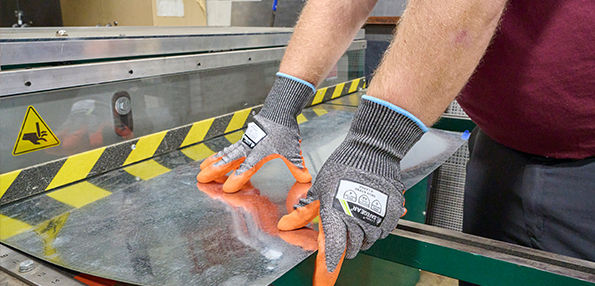 Worker Wearing J.J. Keller SAFEGEAR PPE Gloves 